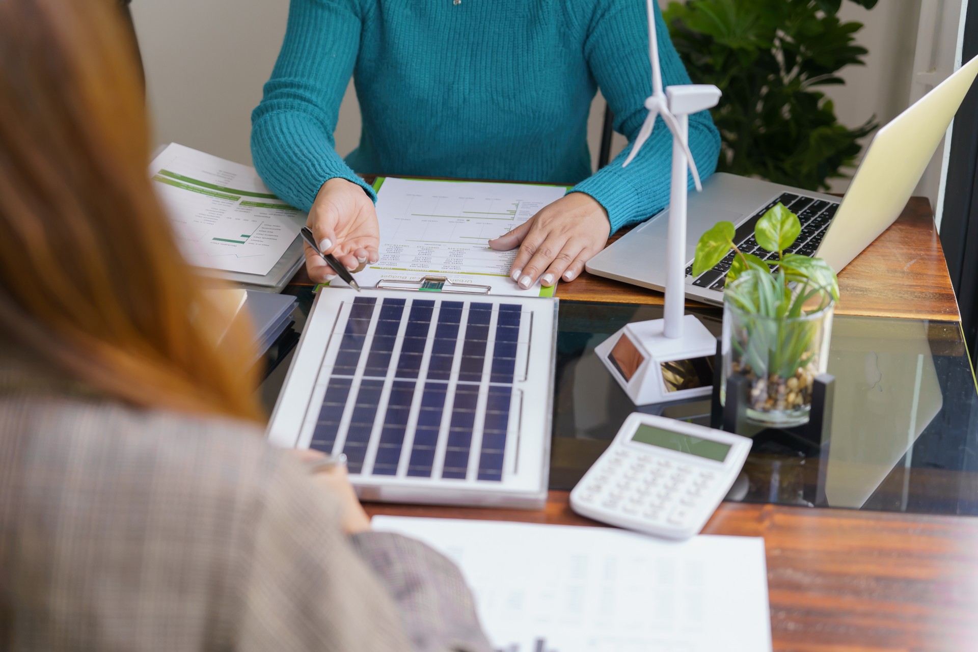 Solar panels green energy Business people working in green eco f